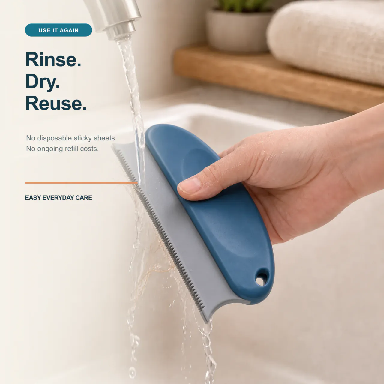 Washable dark blue pet hair remover brush being rinsed and hung to dry